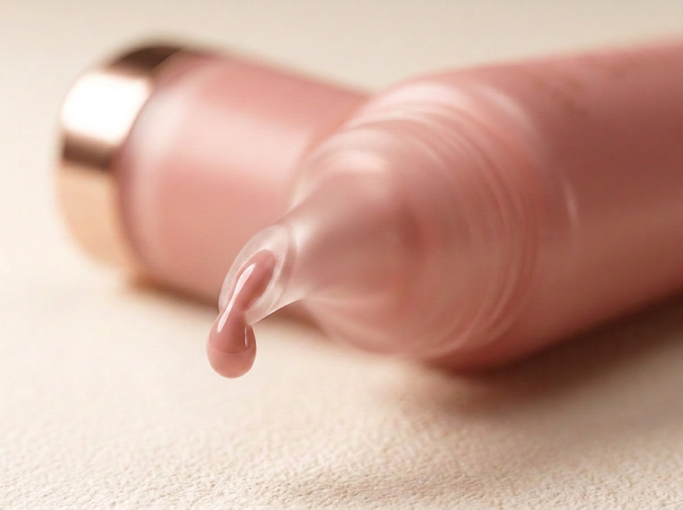 Concept render — a droplet of Savage Lips gloss at the tube tip